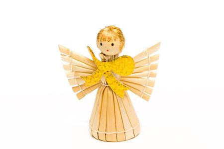 The angel made of straw, with the big gold bowの写真素材