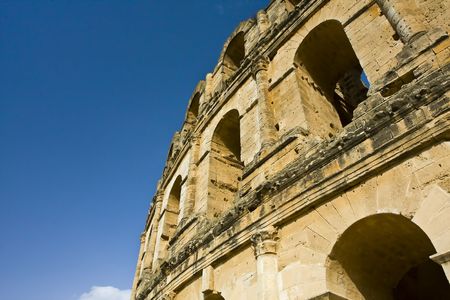 Part of an old amphitheatre against the blue skyの写真素材