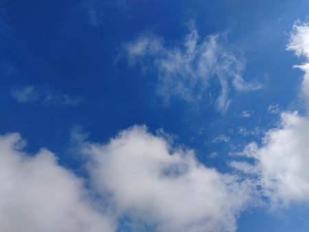 clear blue sky with white cloudsの写真素材