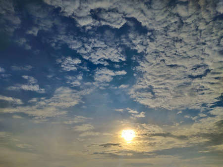 beautiful sunrise with blue sky and white clouds