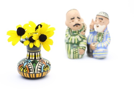 Rudbeckia in a vase with ceramics dollの写真素材