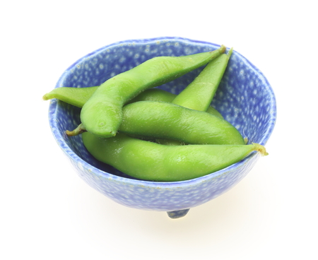 Green soybeans in a blue bowlの写真素材