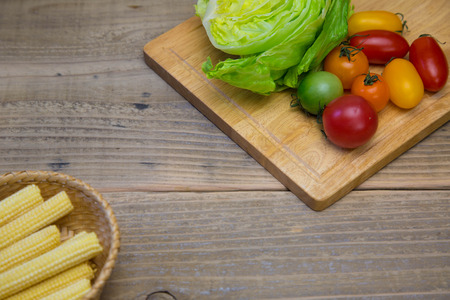 Vegetables for salad on a wooden backgroundの写真素材