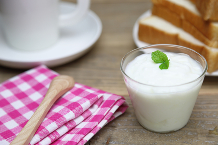 Yogurt on a wooden backgroundの写真素材