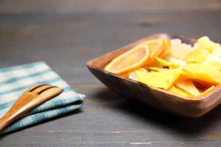 Dried fruits in a wooden bowlの写真素材