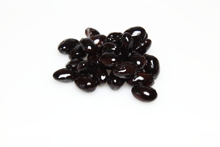 Boiled black beans in a white background