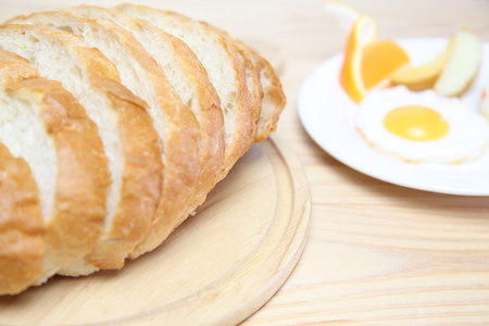 sliced breads on a wooden cutting boardの写真素材