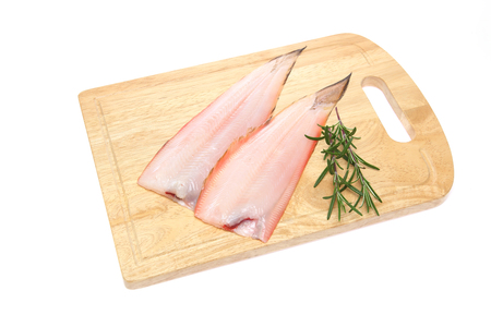 fillet of sole on a cutting boardの写真素材
