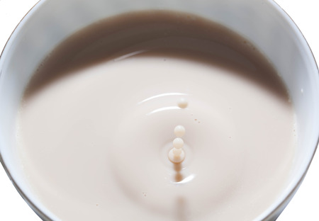 splashing of tea with milkの写真素材