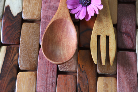 fork and spoon on the wooden blockの写真素材
