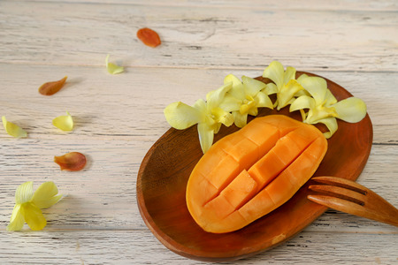 cut mango on a wooden backgroundの写真素材