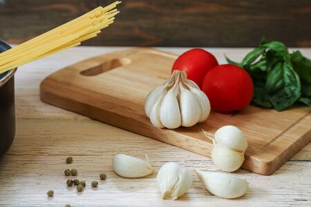 garlics and vegetables a wooden background