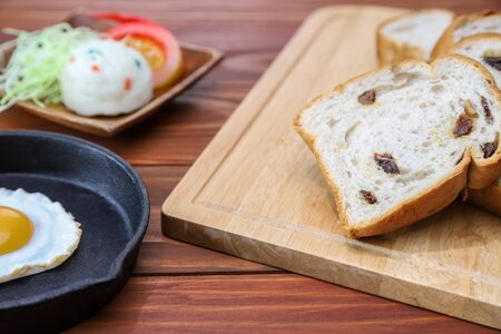 sliced raisin bread on the cutting board