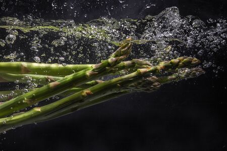 the asparagus in the waterの写真素材