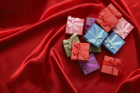 Christmas gift boxes on the red clothの写真素材