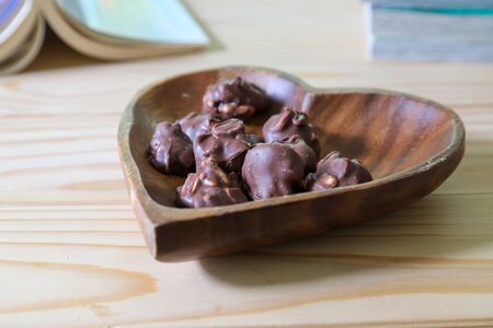 peanut chocolates on the heart shaped plate