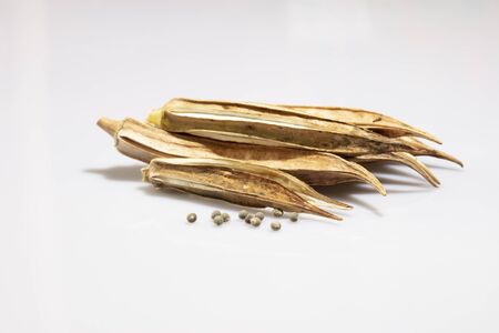 ripe okras in a white backgroudの写真素材