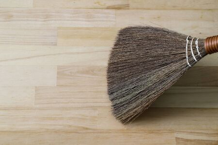 a hand broom on the floorの写真素材