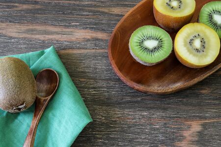 kiwi fruit in a wooden backgroundの写真素材