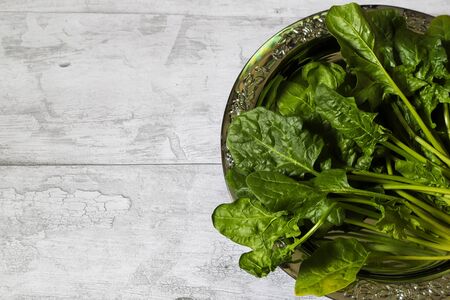 spinach in a wooden background