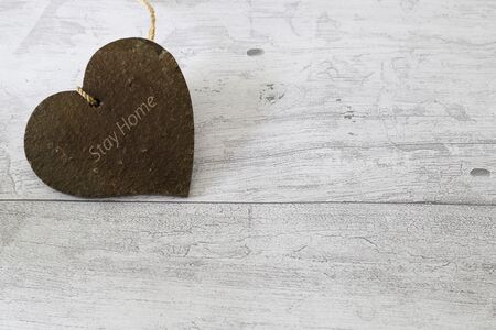 heart shaped terracotta in a wooden background