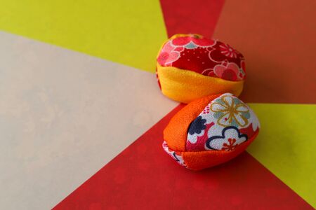 japanese beanbag on the paper with colored figures