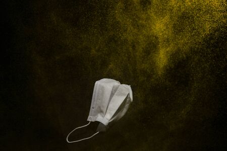 surgical mask in a black backgroundの写真素材