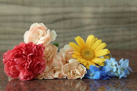 various kind of flowers on the marble plate