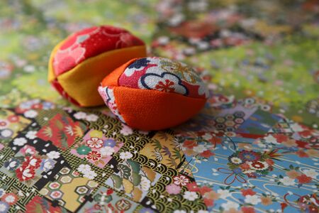 japanese beanbag on the paper with colored figures
