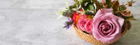 various kind of flowers in a wooden backgroundの写真素材