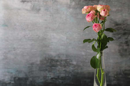bouquet of roses in the glass bottleの写真素材