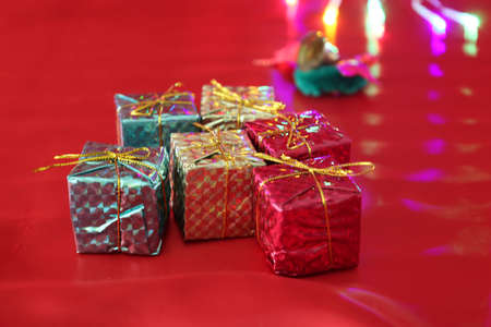 christmas gift boxes on the red cloth