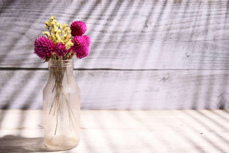 dried flowers in a glass bottleの写真素材