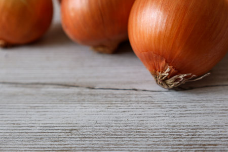 onions in a wooden backgroundの写真素材