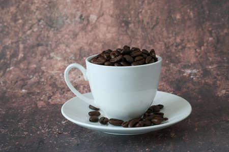 roasted coffee bean and cup in a marble pattren backgroundの写真素材