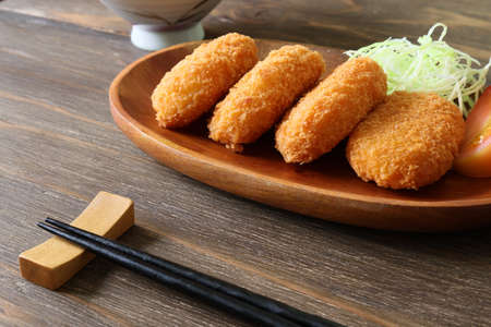 deep fried mashed potatoes covered with bread crumbsの写真素材