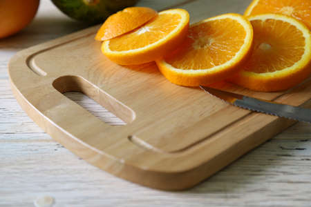 sliced oranges on the cutting boardの写真素材