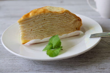 mille crepe pieces of mille crepe in a wooden backgroundの写真素材