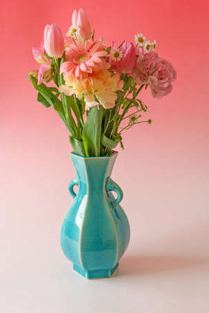 various kind of flowers in the blue vase