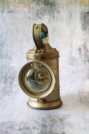 old railroad signal light in a concrete pattern backgroundの写真素材