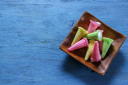 Japanese cheap sweets isolated on a blue wooden background.の写真素材