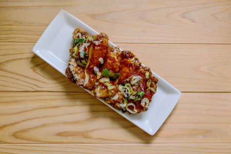 Deep-fried chicken with soy sauce on the white plate.の写真素材