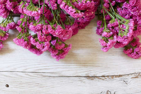 bouquet of statice in a wooden background