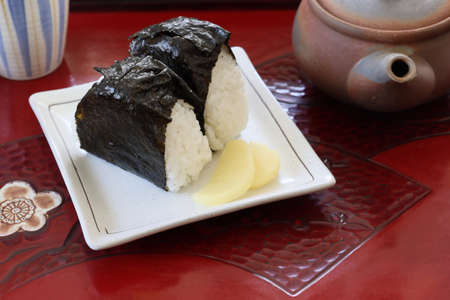 Rice balls on the plate on the tray.