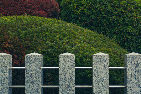 Japanese garden surrounded by stone pillars.の写真素材