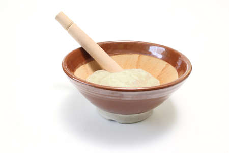 Yam make into a paste in the mortar isolated on a white background.の写真素材