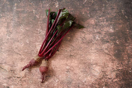 Beets on the cutting board in a marble pattern background.の写真素材