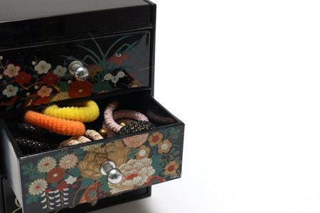 Various hair clips in the Japanese style box isolated on a white background.の写真素材