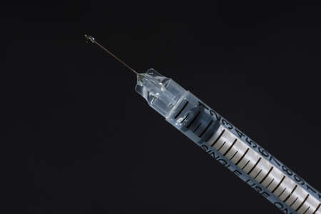 Syringes isolated on a black background.の写真素材