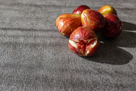 Figs isolated on a stone pattern background.